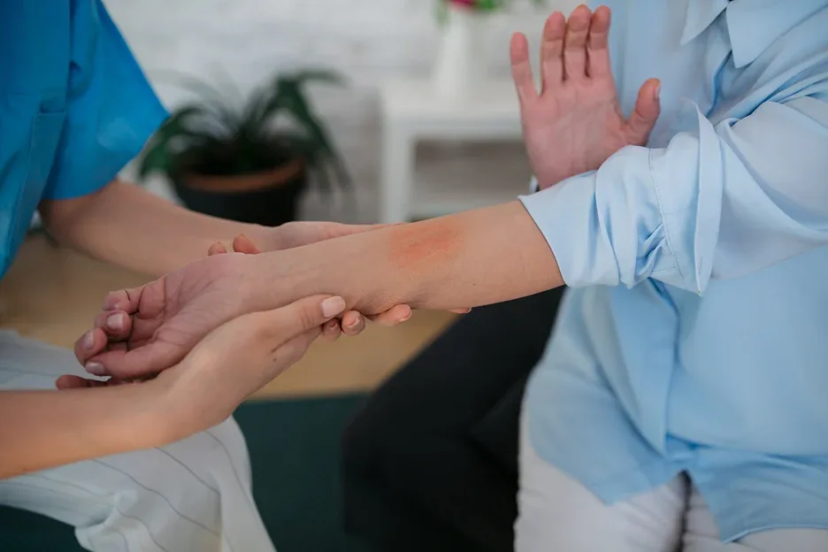 a doctor examines a patient's skin condition
