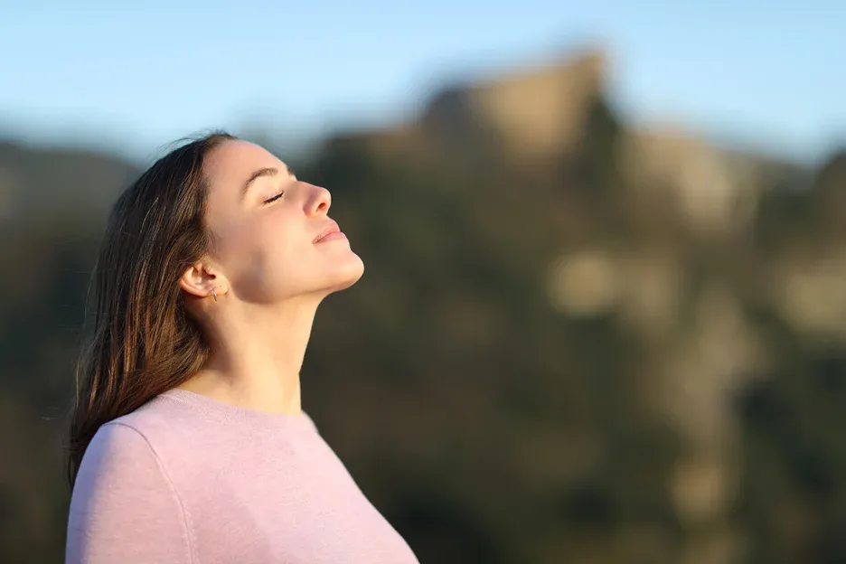 a portrait of a woman relaxing outdoor