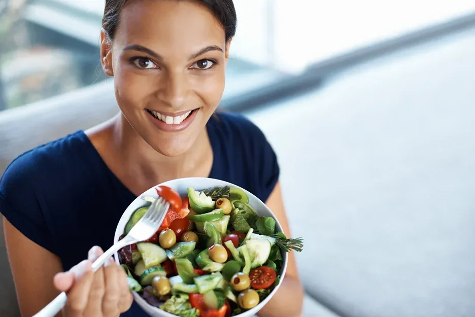 a woman eating a balanced meal