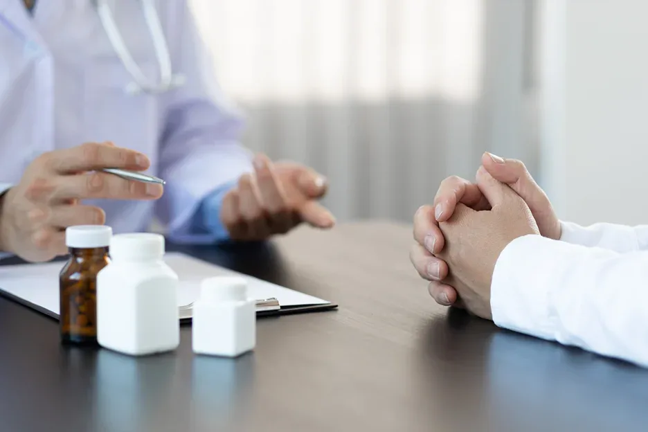 a doctor prescribes medication on the patient