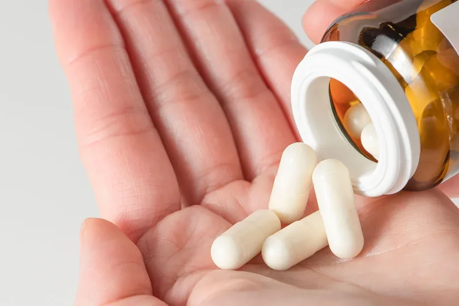 a bottle of white pills