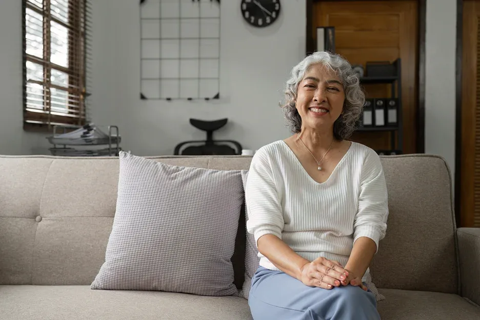 a portrait of an elderly woman relaxing on the couch