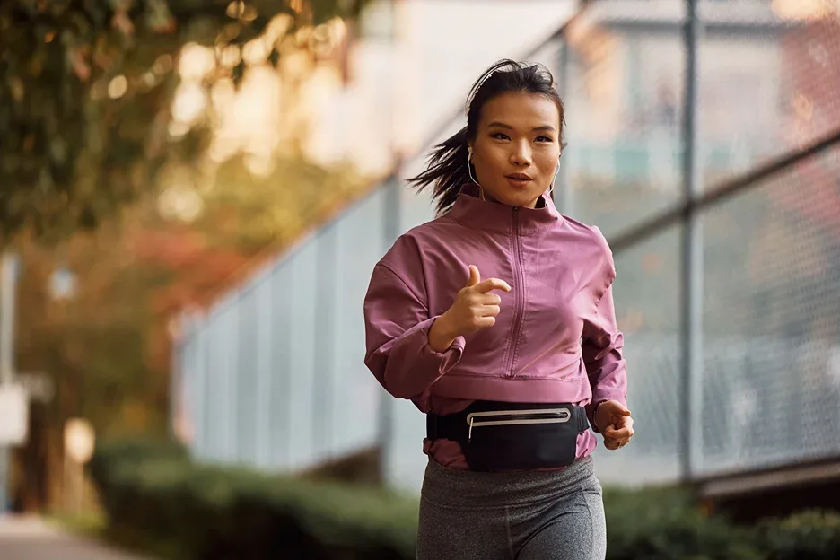 young woman running outside
