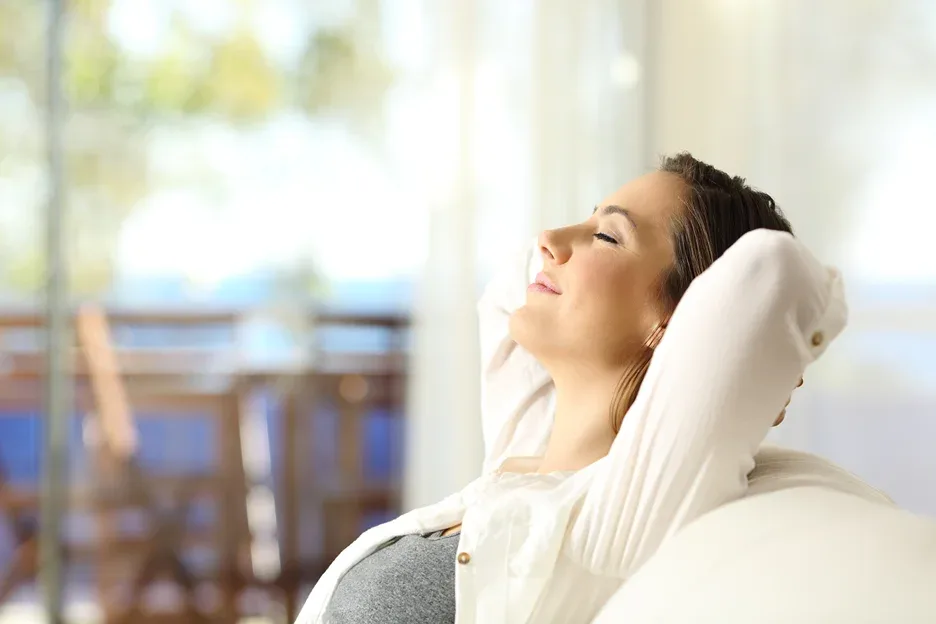 a woman relaxing on the couch