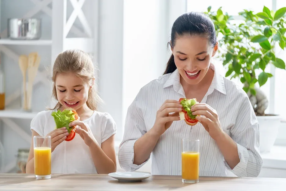 a mother and daughter eating together