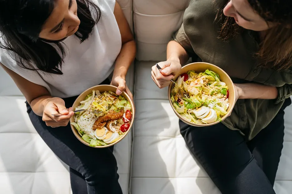 two women having a healthy meal together