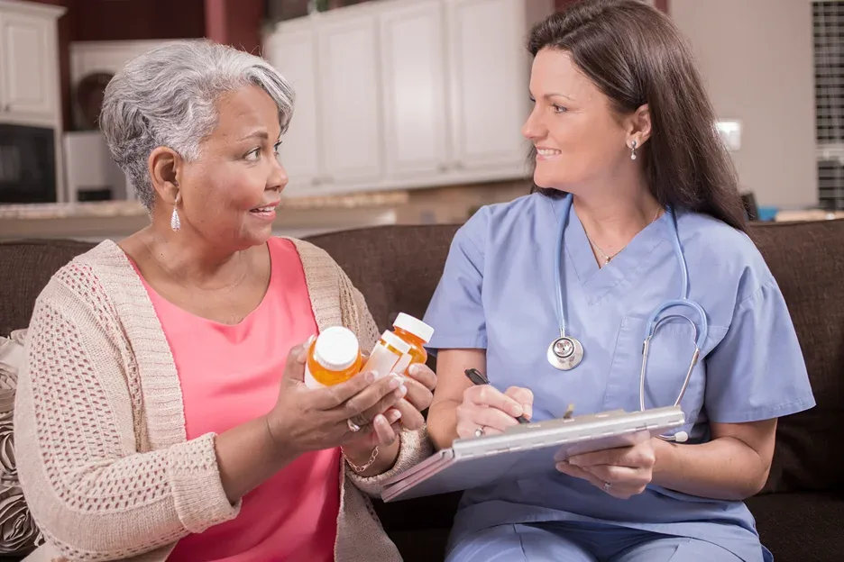 a senior woman consults her doctor with regards to her medication dosage