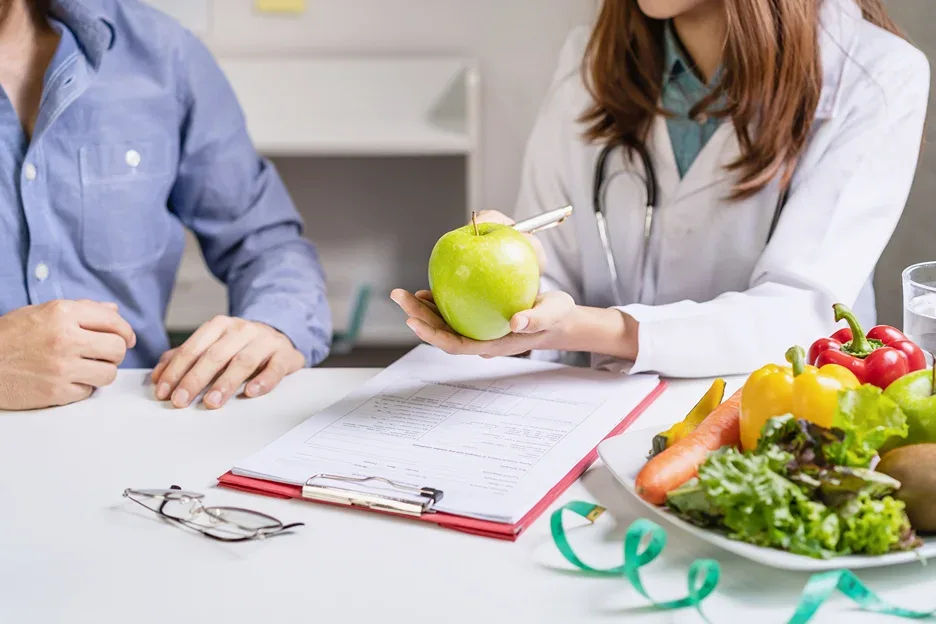a man consults a nutritionist for healthy meal planning