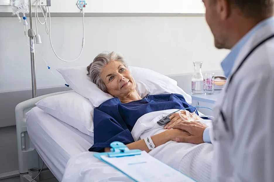 a sick elderly woman talks with her doctor